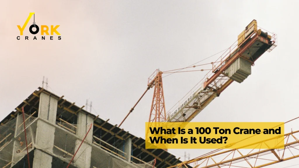 100 ton crane lifting heavy construction materials at an industrial job site