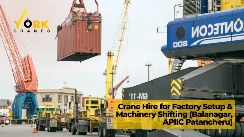 Industrial crane rental in Hyderabad lifting heavy manufacturing machinery during a factory setup and equipment shifting project.